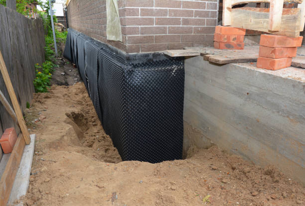 Happy homeowners after waterproofing job in Devon
